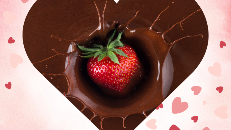 A beautiful Strawberry dropping into chocolate.